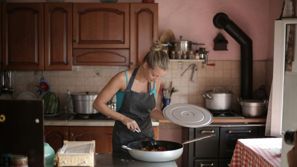 Woman Standing Near the Kitchen Counter