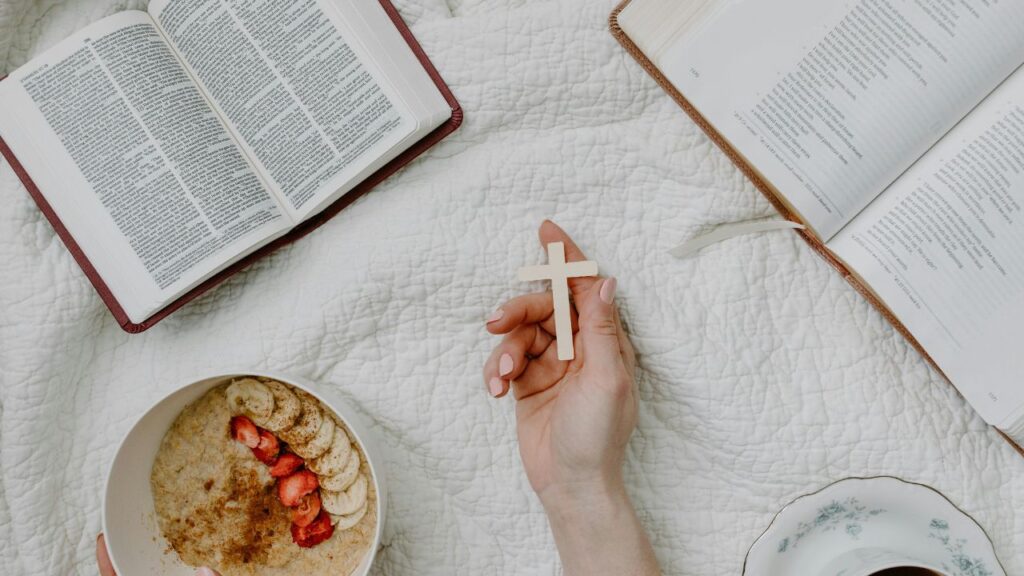 Person Holding a Cross