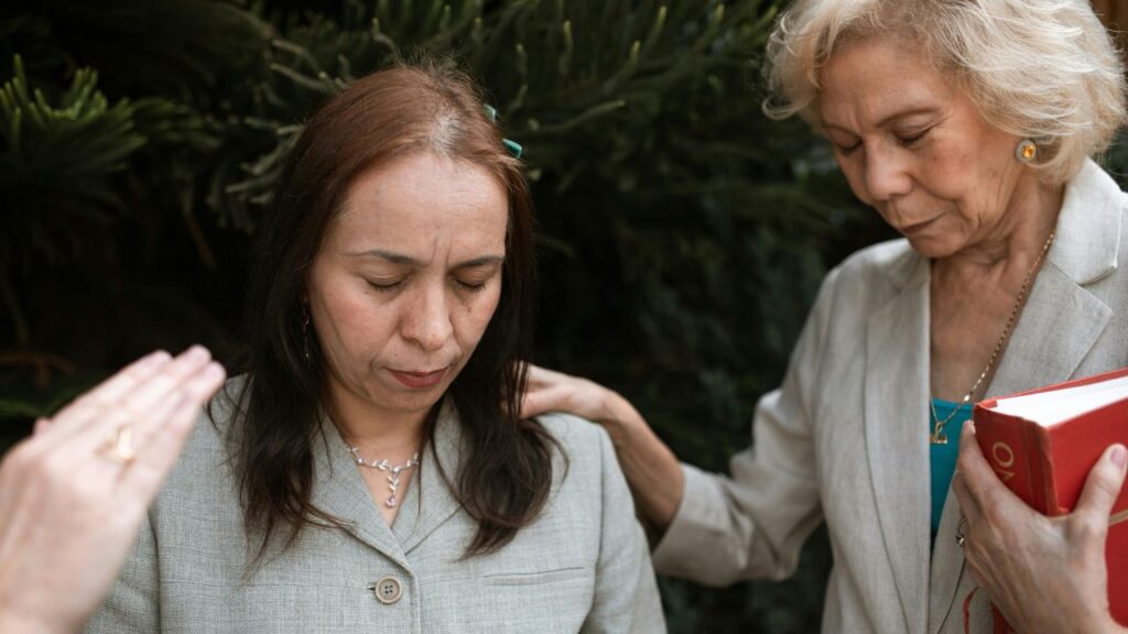 Women Praying with Eyes Closed