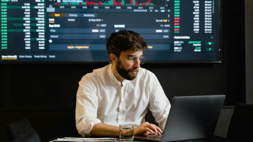 Man in White Dress Shirt Using Laptop