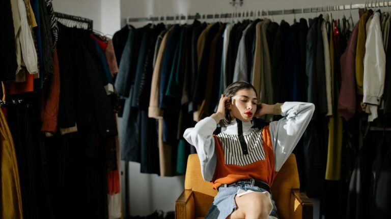 Woman in Stylish Outfit Sitting on Chair
