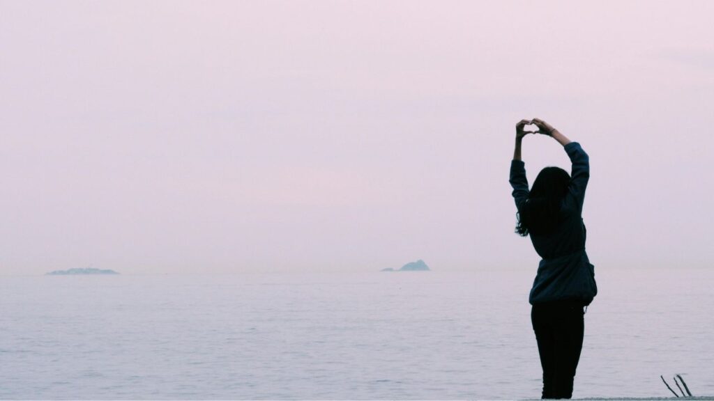 Woman Standing Near Body of Water