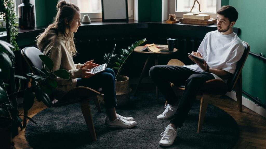 Photo of Man and Woman Talking to Each Other