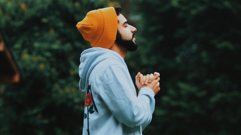 Man Wearing Bonnet and Hoodie