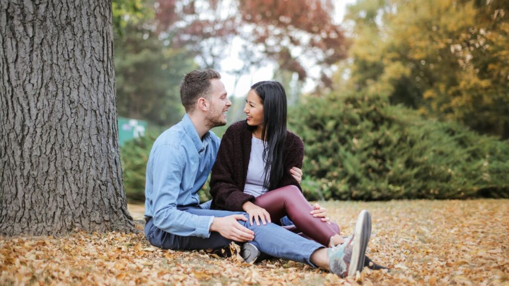 Couple Sitting Under The Tree During Daytime