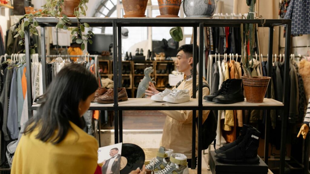 A photo of people looking for items in a thrift store