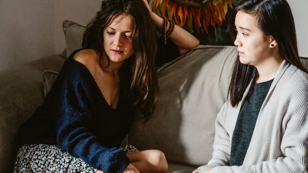 A Woman Supporting a Friend in Sorrow