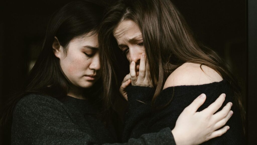 Woman Giving Comfort to an Emotional Woman