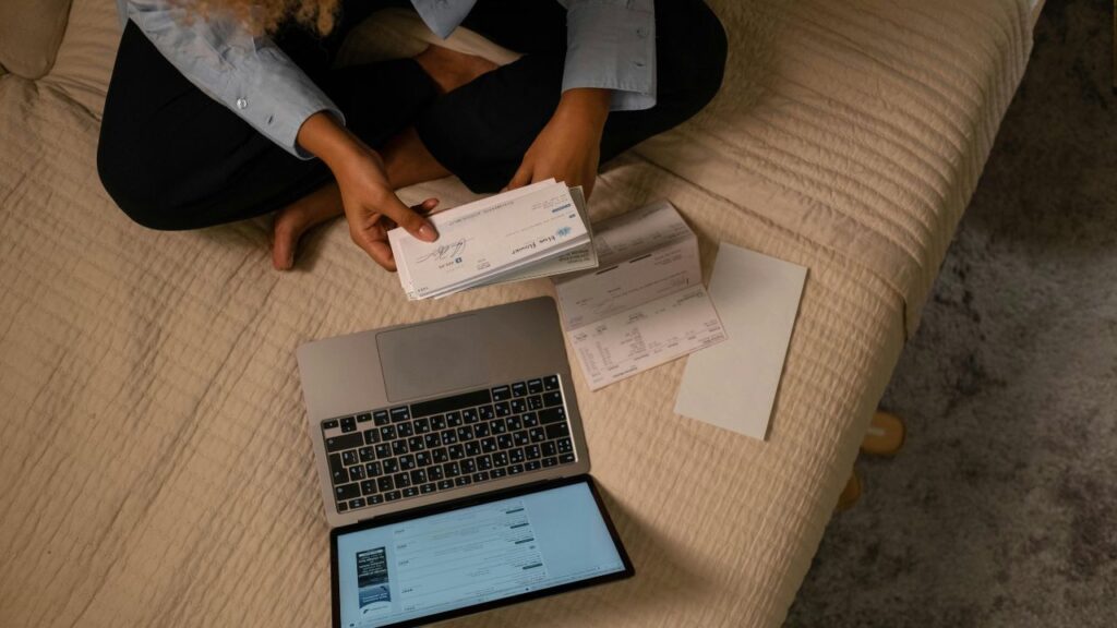 Overhead Shot of a Woman Holding a Cheque