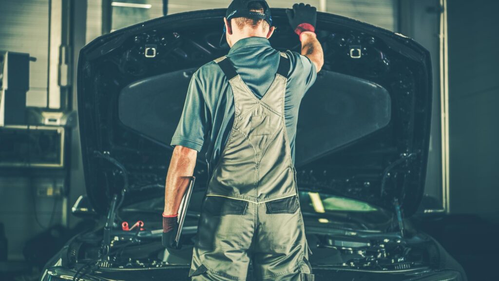 Satisfied Mechanic Closing the Vehicle Bonnet