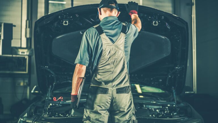 Satisfied Mechanic Closing the Vehicle Bonnet