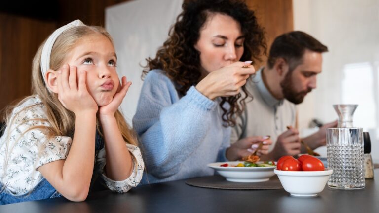 Close up on family enjoying food together