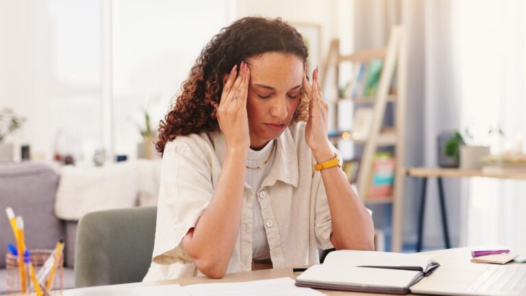 Freelancer business woman and headache with laptop for solution information and network glitch Remote work female person and web designer with stress for online page connection issue or migraine