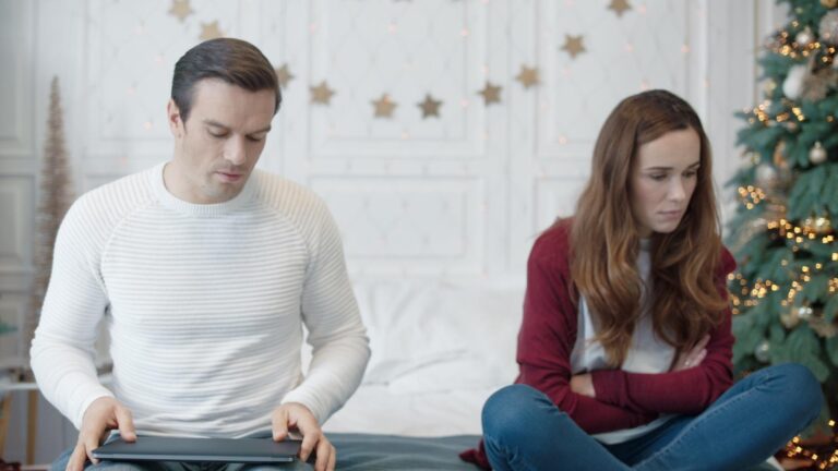 Handsome man saying sorry to woman in luxury house Sad woman feeling hurt