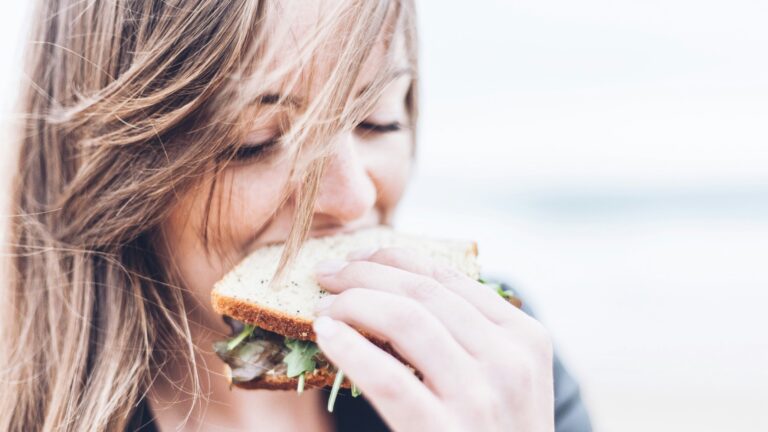 woman eating sandwich