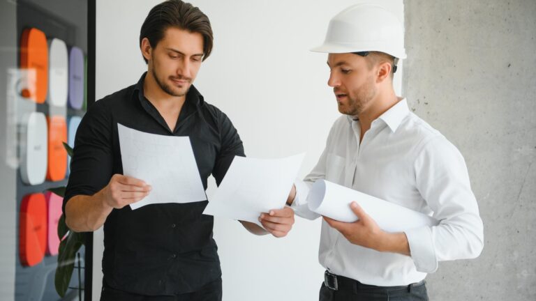 Architect concept Architects working with blueprints in the office