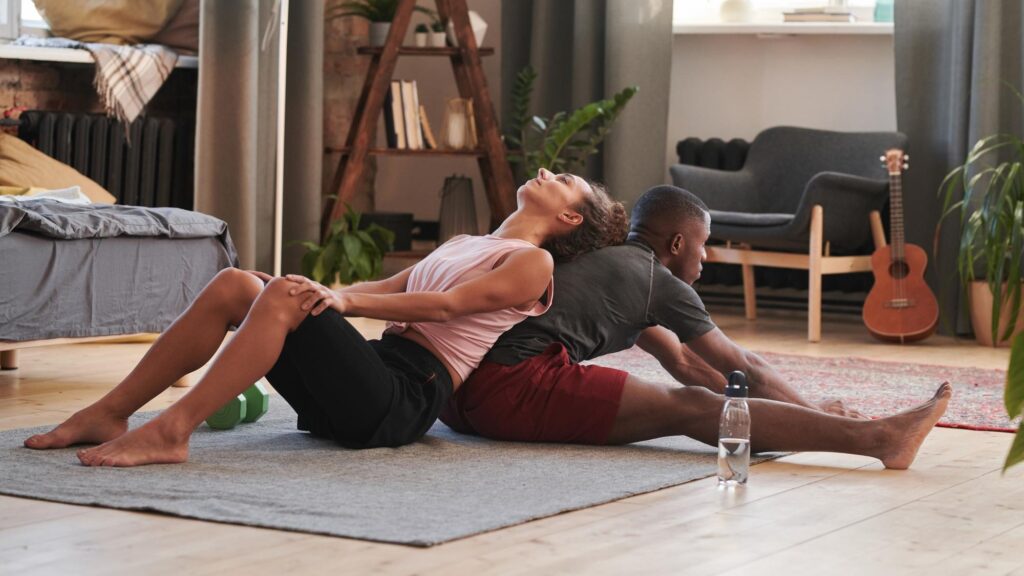 Couple doing stretching exercise