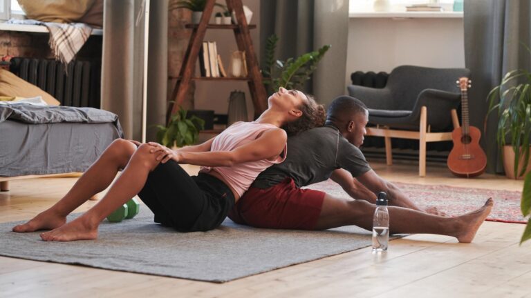 Couple doing stretching exercise