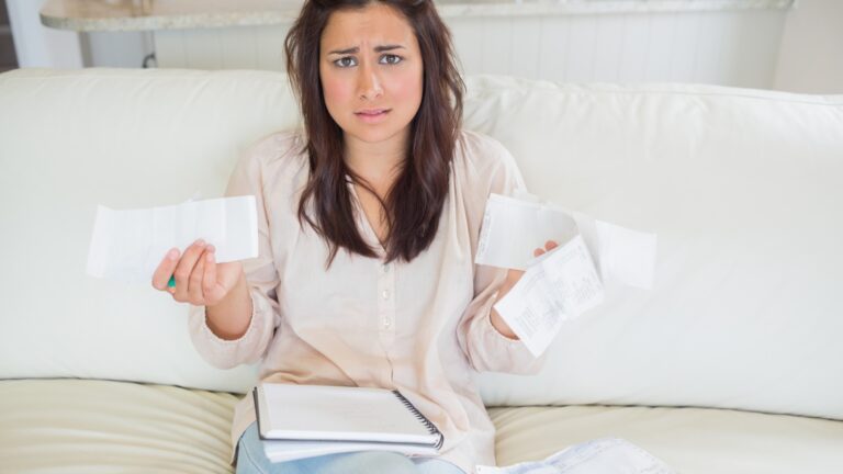 Woman getting stressed over bills