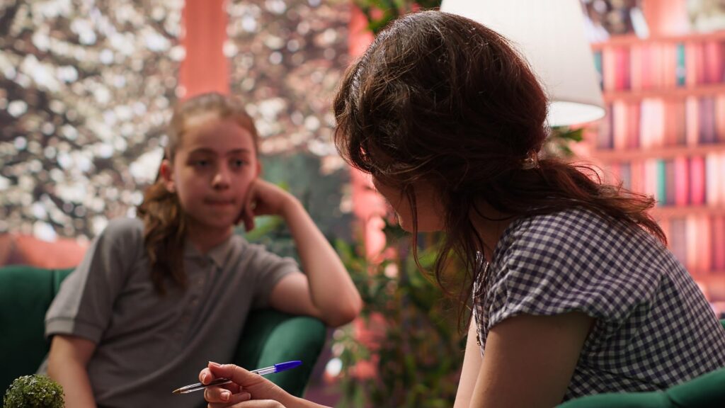 Teen girl in psychotherapy addressing emotional management issues