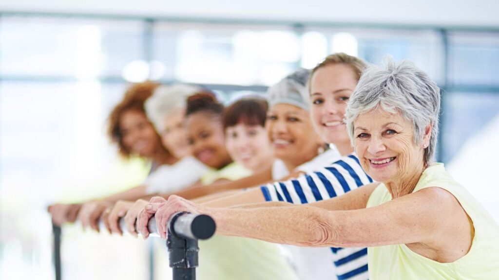 Barre workout and health with portrait of women in studio for club stretching and ballet exercise Pilates wellness and strength training with people in class for balance fitness and diversity