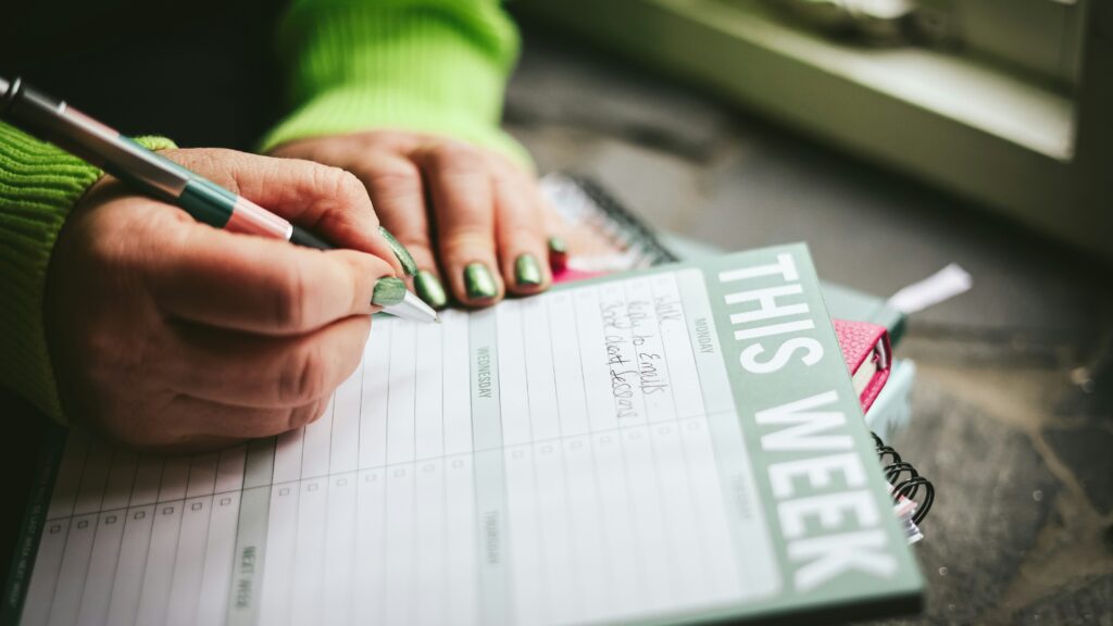 A person writing on a piece of paper