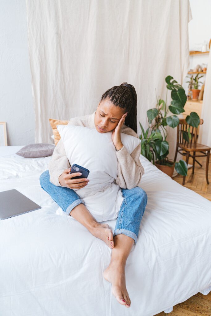 stressed woman looking at phone