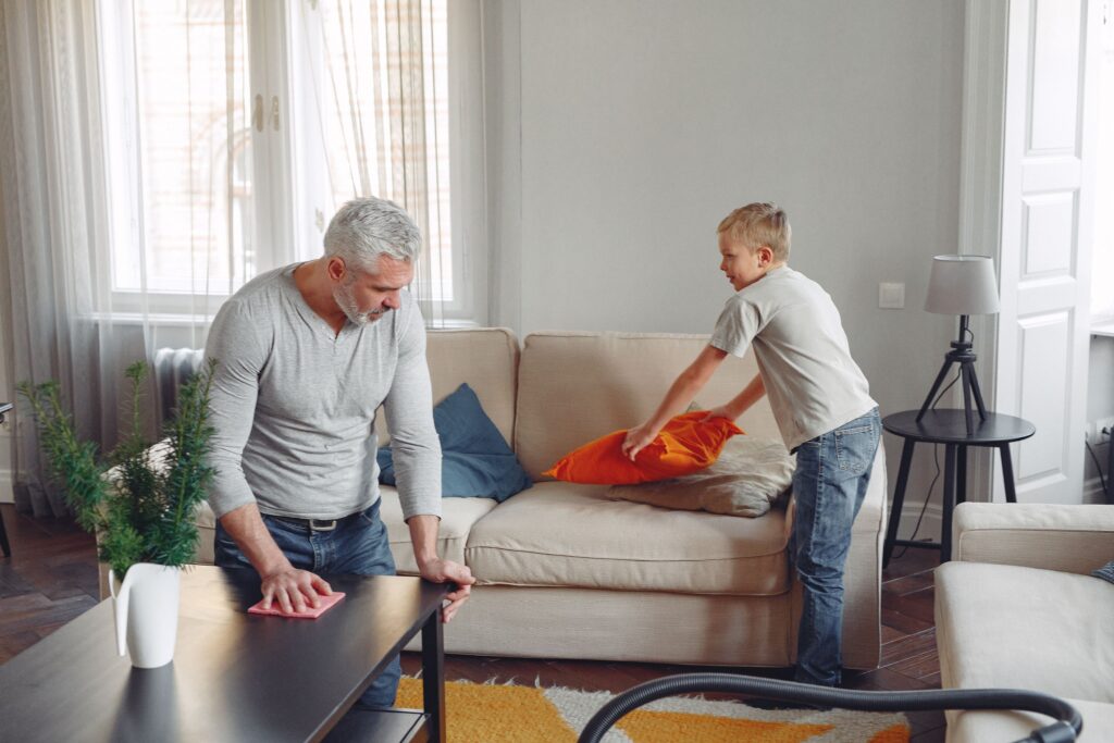 dad and son cleaning house