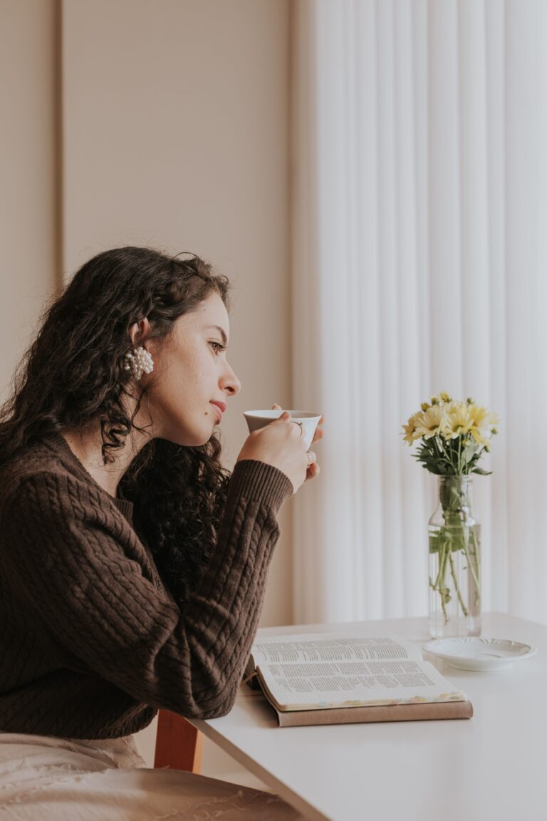woman enjoys a quiet moment sipping coffee at home