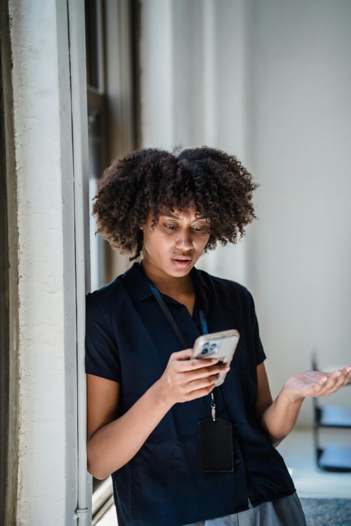 woman receiving security alert on her phone