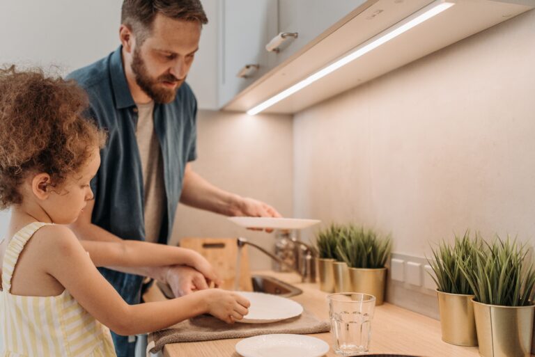 man and child in kitchen