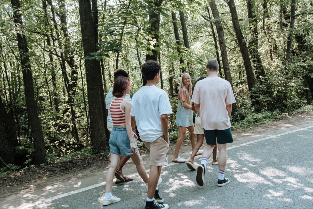 parents and teenagers taking a walk