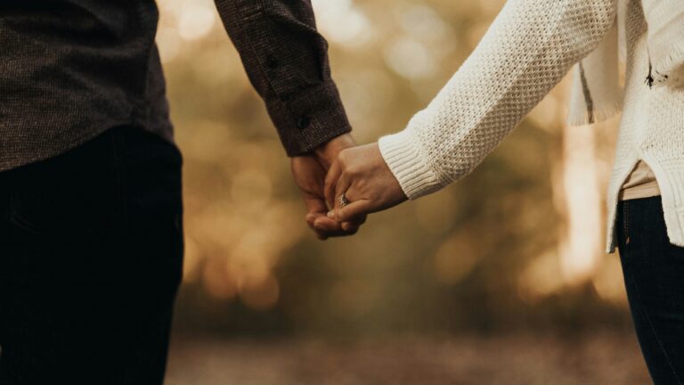 woman and man holding hands