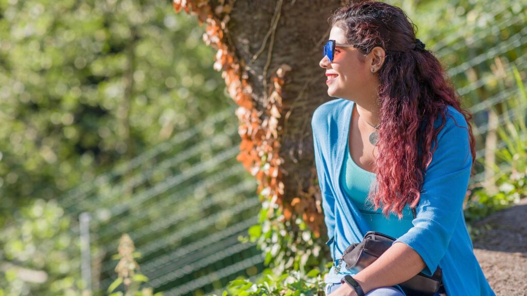 Thinking outside in nature wellness self care relaxation south american woman in senda del oso