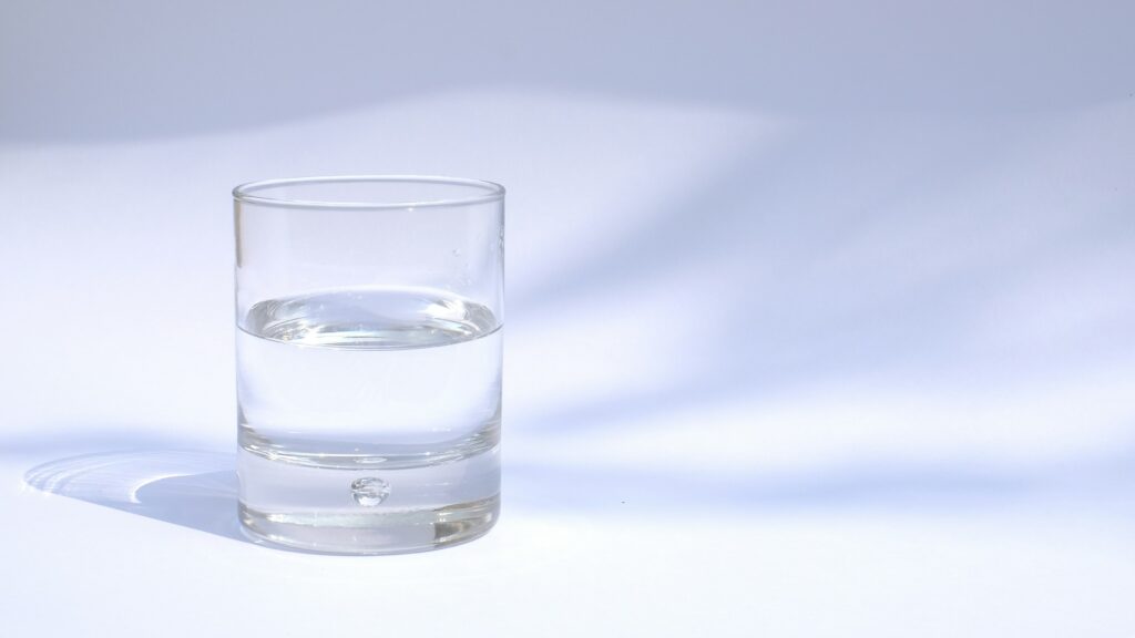 clear drinking glass filled with water