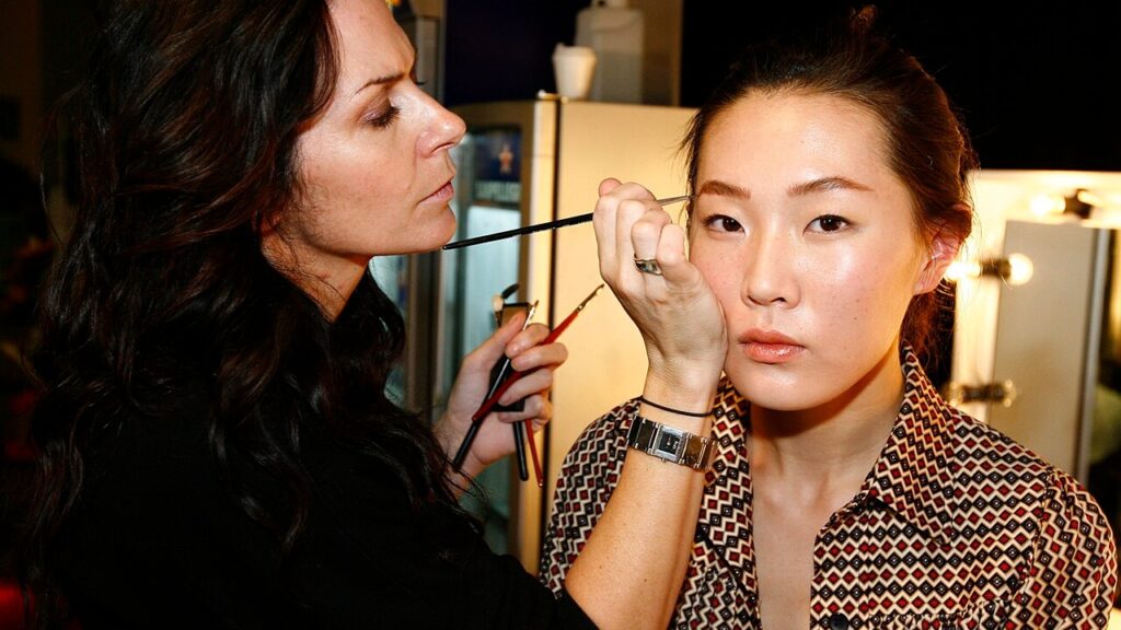 Make-up artist backstage at the Lee Matthews show, Spring/Summer 2007 Australia Fashion Week