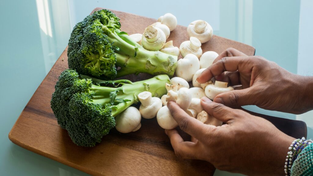 white garlic on brown wooden chopping board