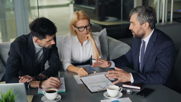 a group of people sitting around a table
