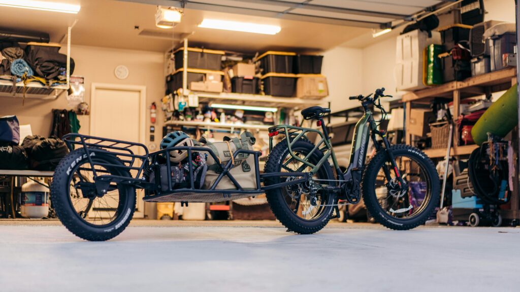 a motorcycle is parked in a garage next to a motorcycle
