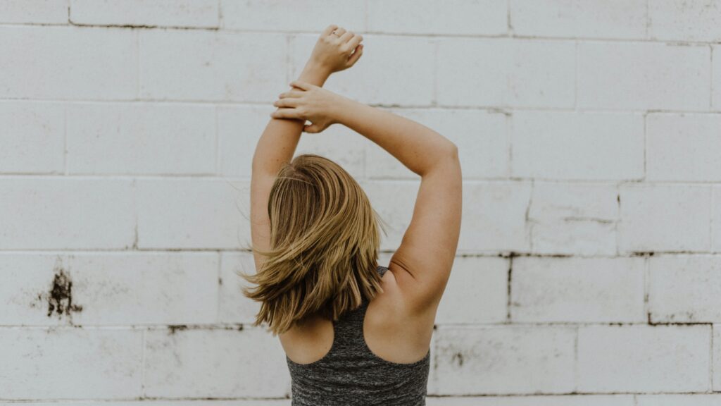 woman wearing grey racerback top