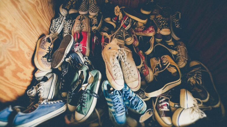 photography of assorted-color shoes lot on box