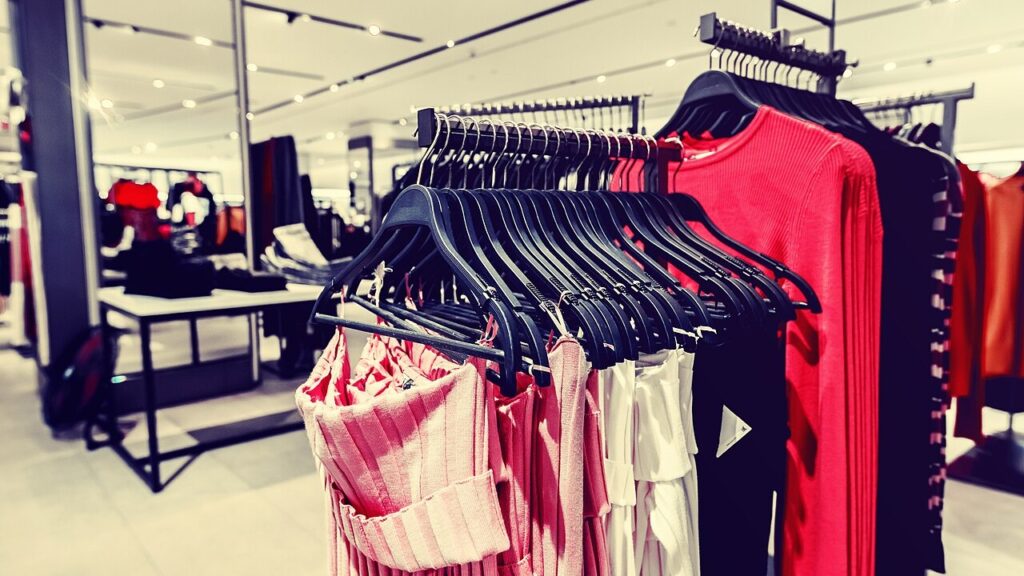 Women clothes in fashion store. Shopping mall. Women fashion shopping.