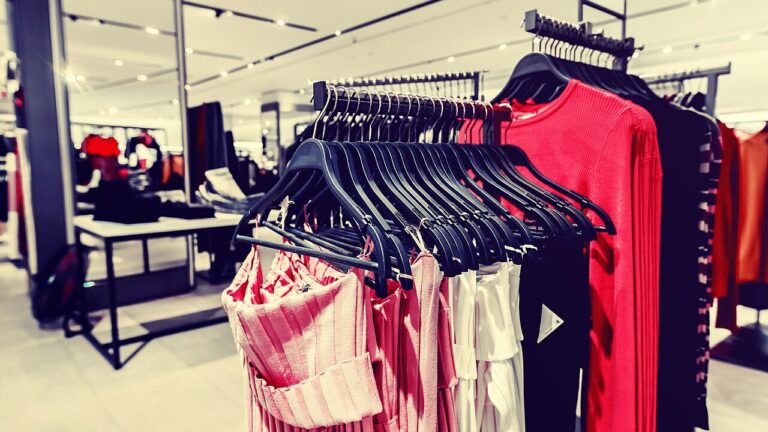 Women clothes in fashion store. Shopping mall. Women fashion shopping.
