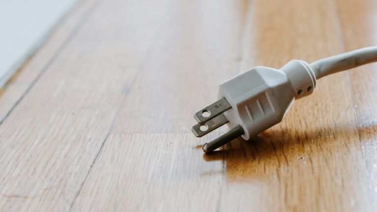 white usb cable on brown wooden table