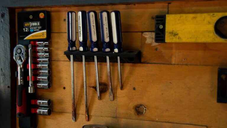 a bunch of tools hanging on a wall