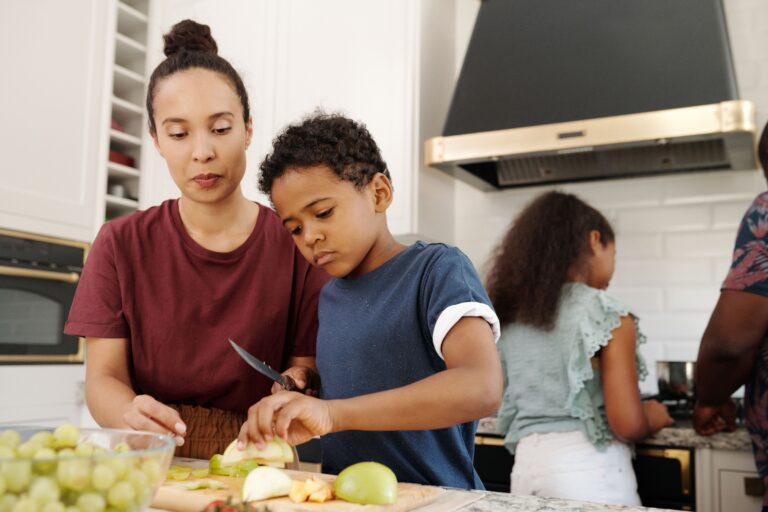 family preparing food together in kitchen