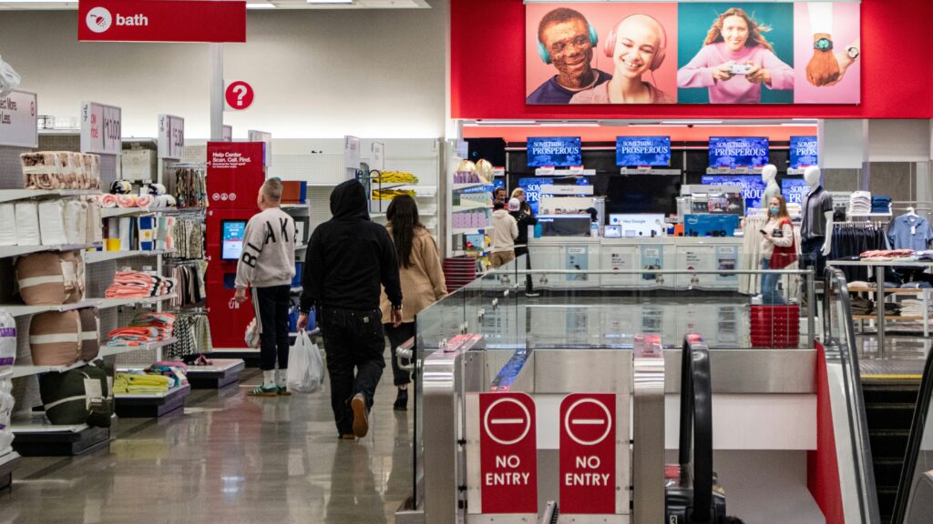 People shop in a target store aisle.