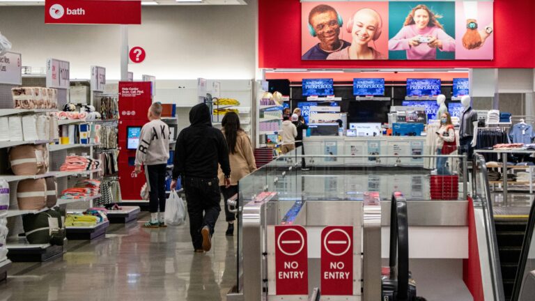 People shop in a target store aisle.