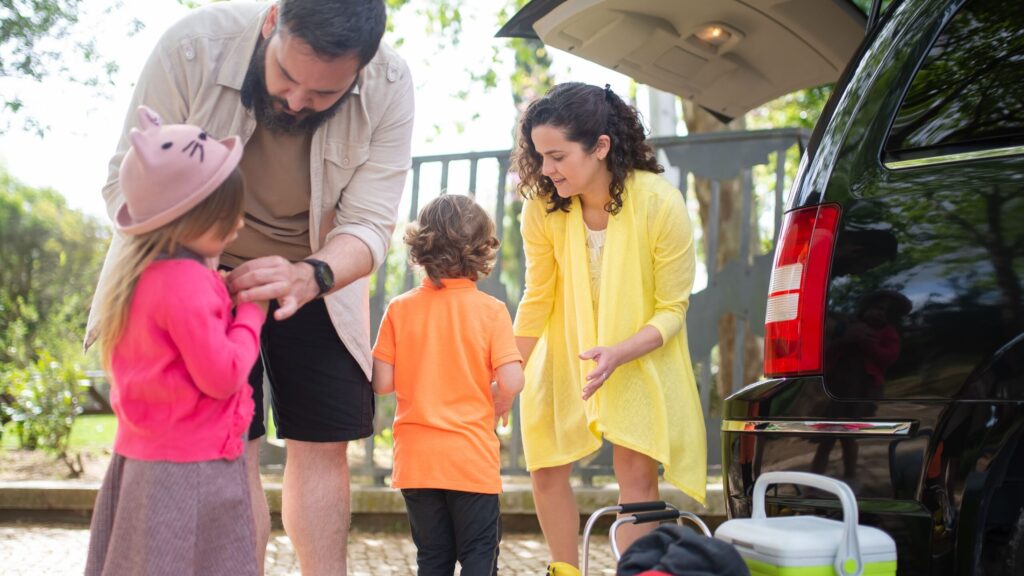 family packing car for road trip