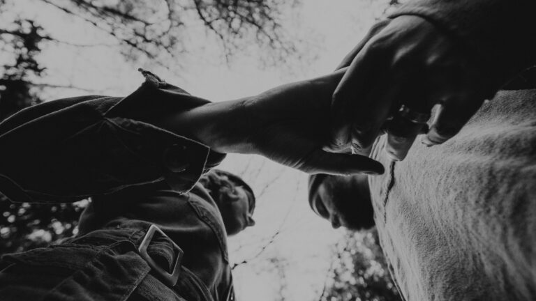 grayscale photo of man in button up shirt